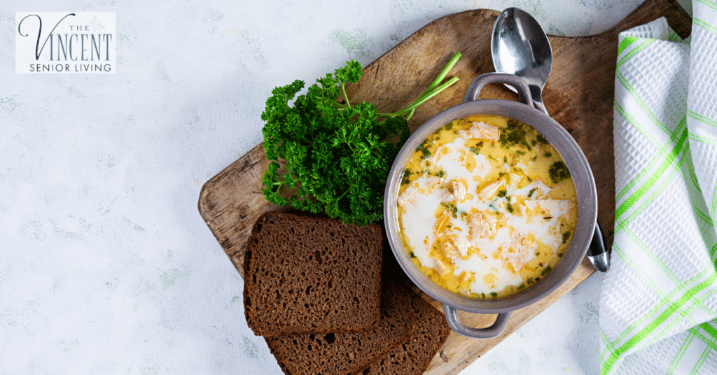 Caring for people with dementia in winter: creamy salmon soup with potato, carrot, leek