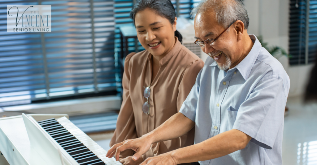 Music Therapy for Alzheimer's Care. An asian senior elderly couple is playing the piano together.