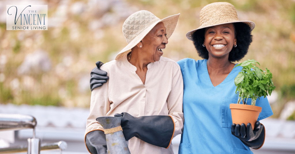 Activities for memory care: older woman gardening outdoors with a smiling care partner.