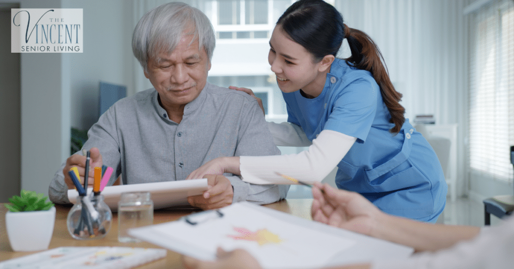 A senio man with a helpful care partner at home