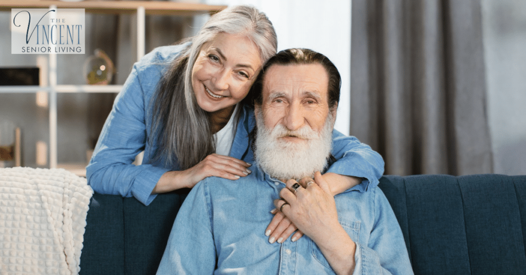 Affectionate senior couple sitting together at home, showing the importance of connection and communication strategies for dementia.